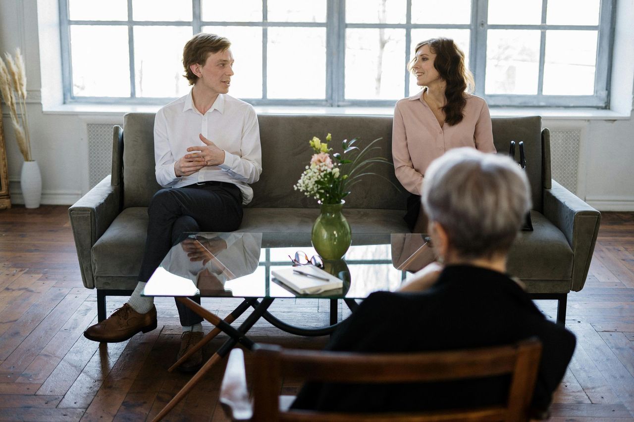 A couple working together with a therapist in a supportive counseling session