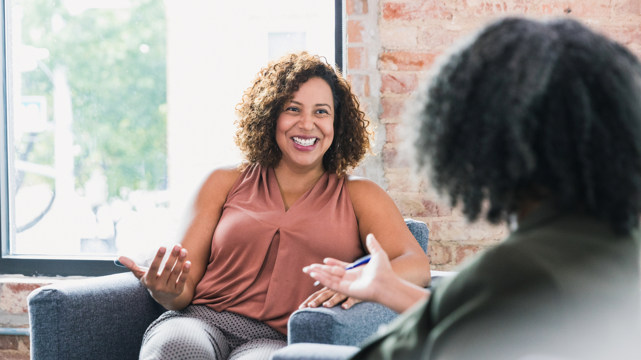 Two women smiling together